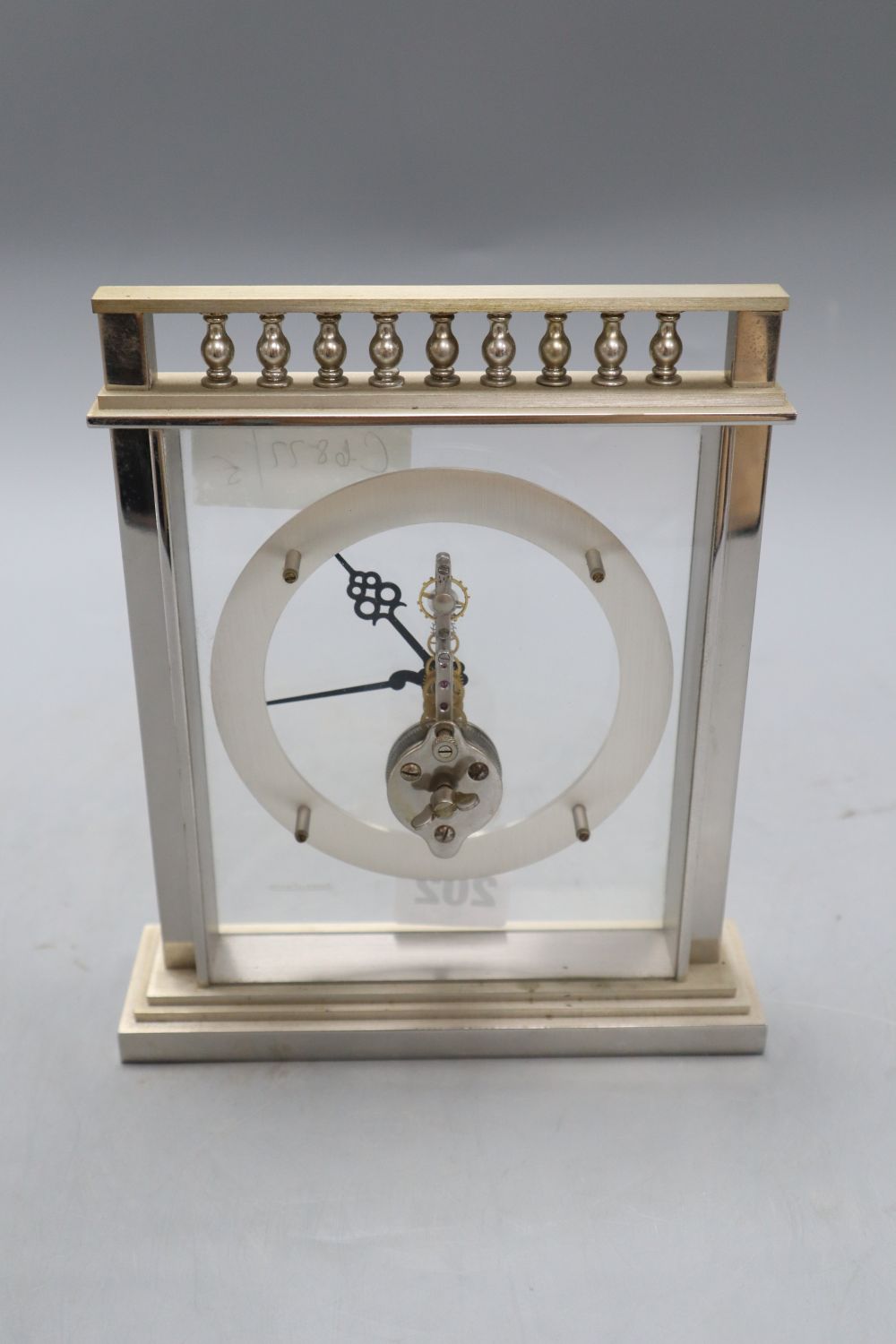 A Jaeger Le Coultre chrome plated skeleton timepiece, height 19cm